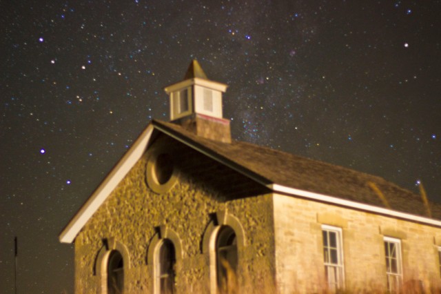 Starry night on the plains of Kansas reveal the stillness of this old one room school and the galaxy beyond it.